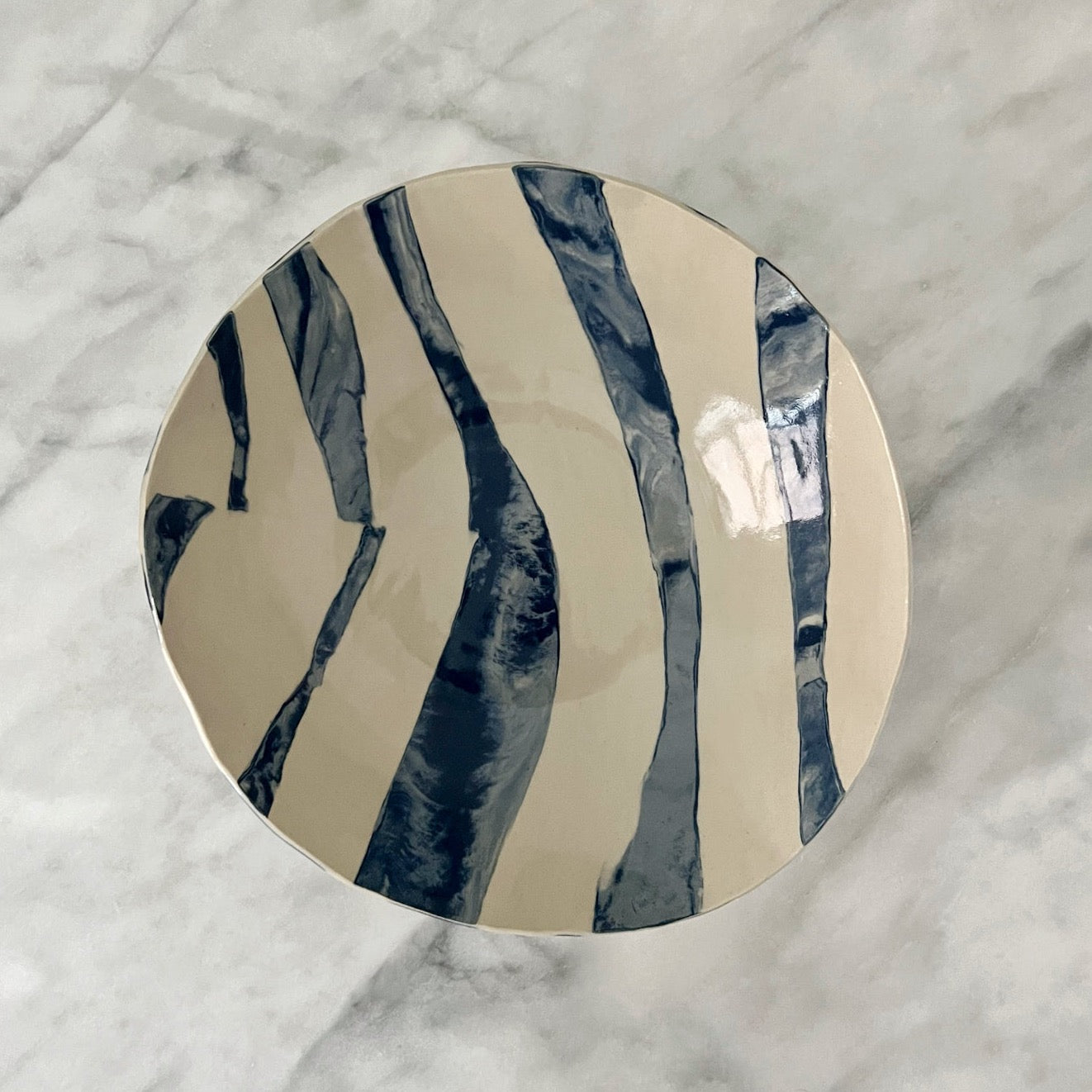 one of a kind ceramic blue and off white plates made in Corsica