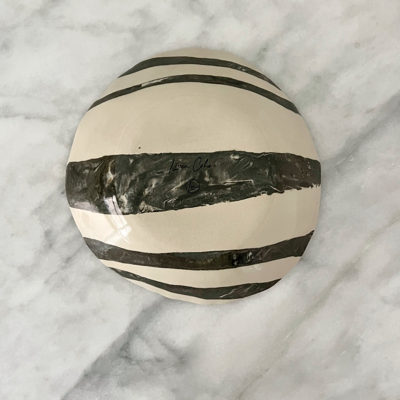 one of a kind ceramic anthracite and off white plates made in Corsica