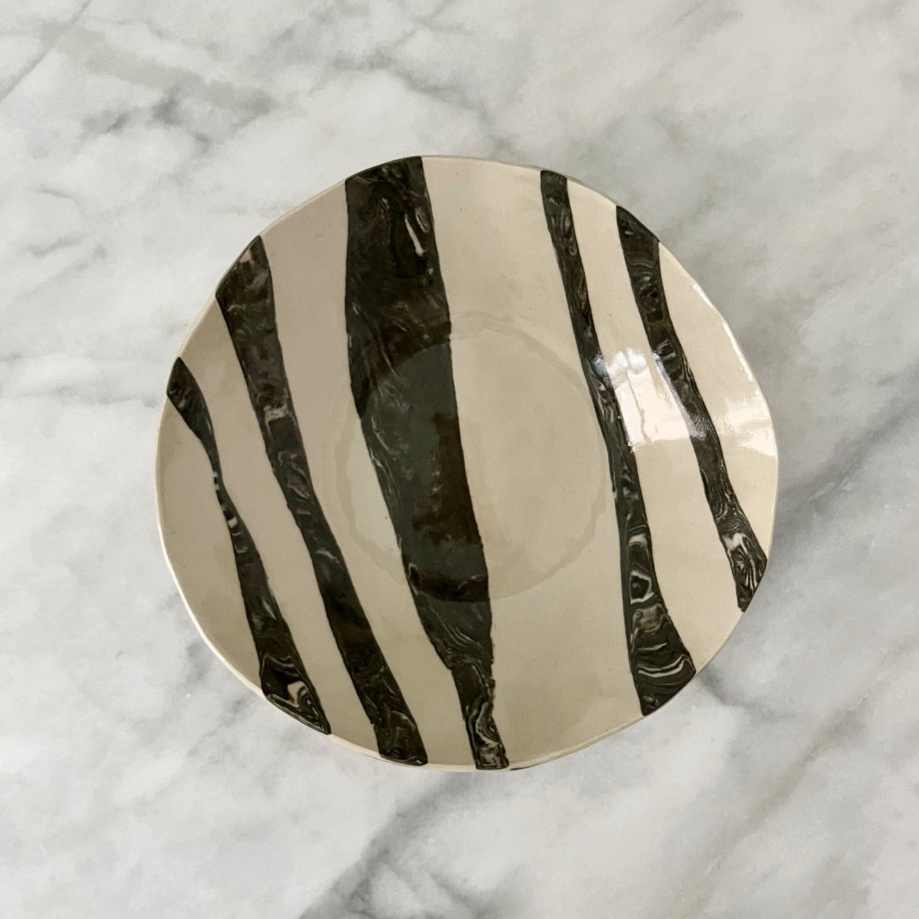 one of a kind ceramic anthracite and off white plates made in Corsica