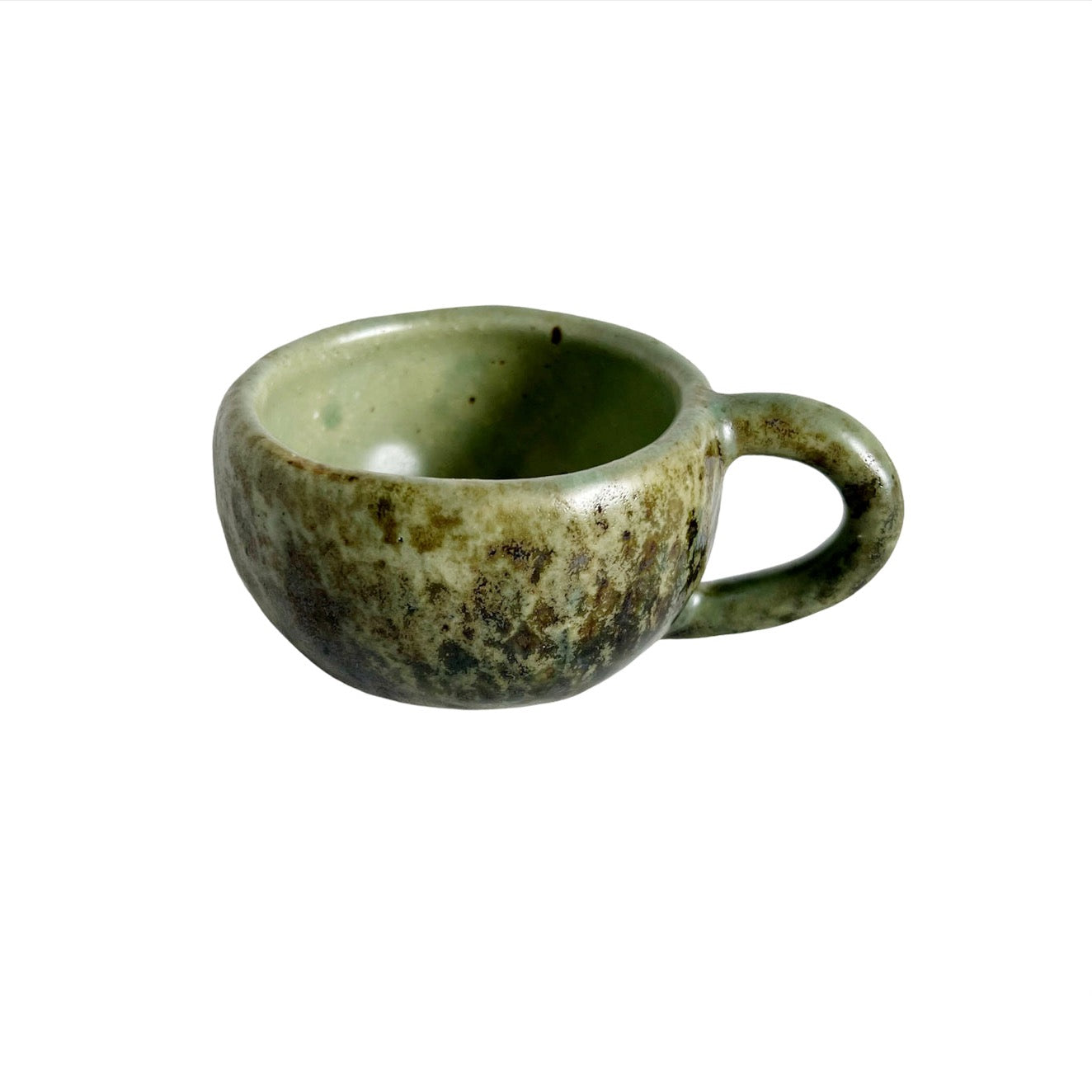 handmade coffee cups from Mexico with a green and brown glaze